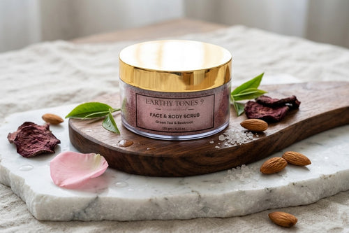 Earthy Tones 9 face and body scrub jar on a marble surface with almonds and rose petals.