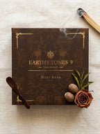 Brown skincare product gift box labelled 'Earthy Tones 9' with decorative elements on a light background.