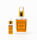 Earthy Tones 9 glow face oil 30ml & 5ml two bottles on white background